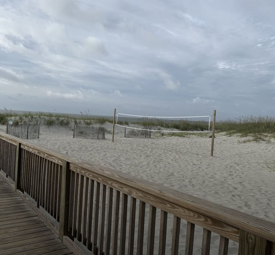 Play a game of sand volley ball