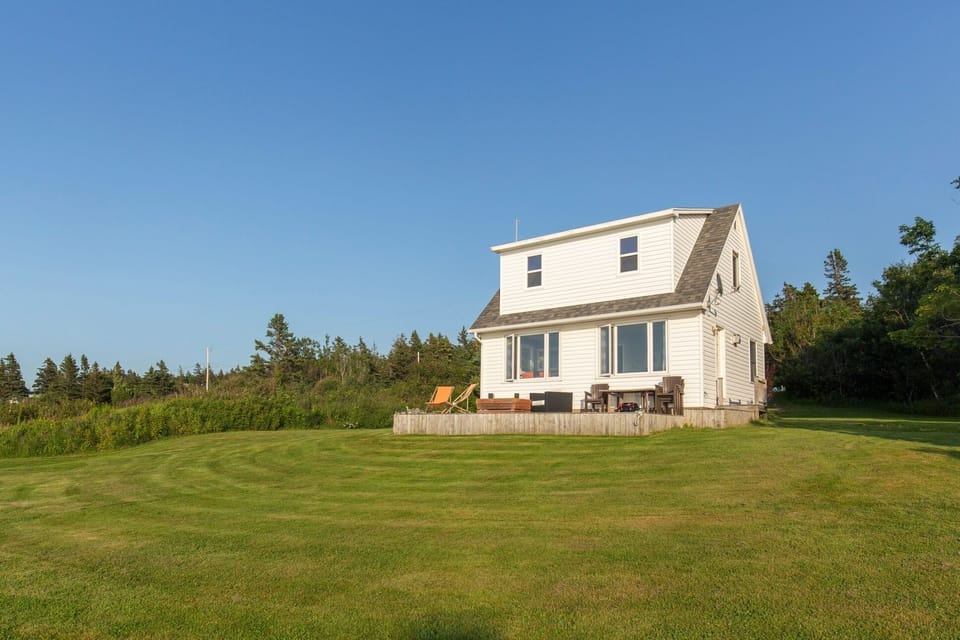 Large decking at oceanfront of cottage for your morning coffee enjoyment