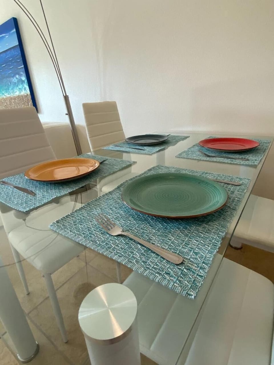 four of the eight place settings for dining 