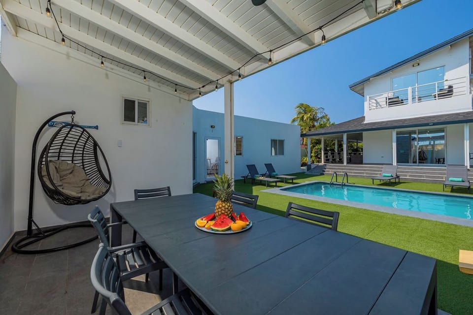 Our poolside table and chairs set the scene for unforgettable moments with friends and family.