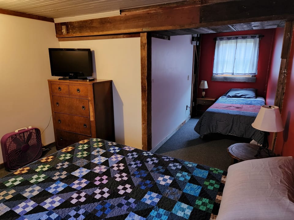 3rd Bedroom, ground level. There is one full size bed and one twin size bed. 