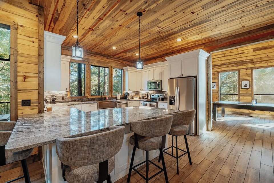 Grab a chair around the kitchen island while your favorite chef prepares dinner