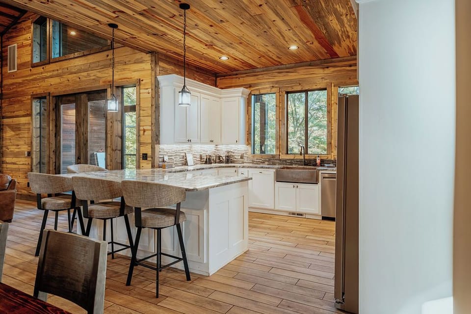 The kitchen is fully stocked and has stainless steel appliances