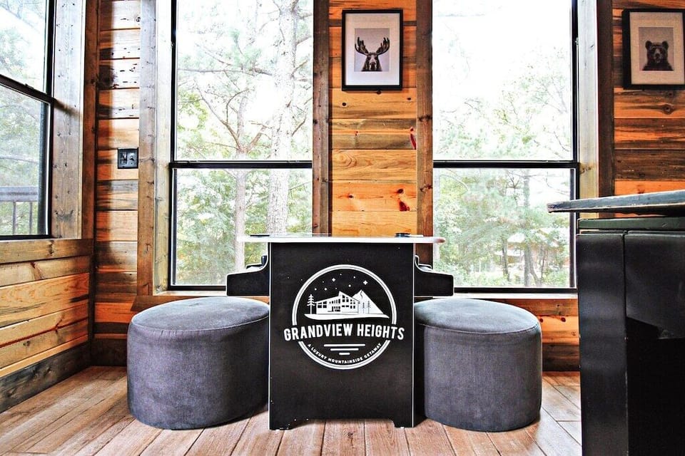 A signature touch to the game room, this custom-branded bar table provides a perfect spot to enjoy drinks while taking in the surrounding forest views.