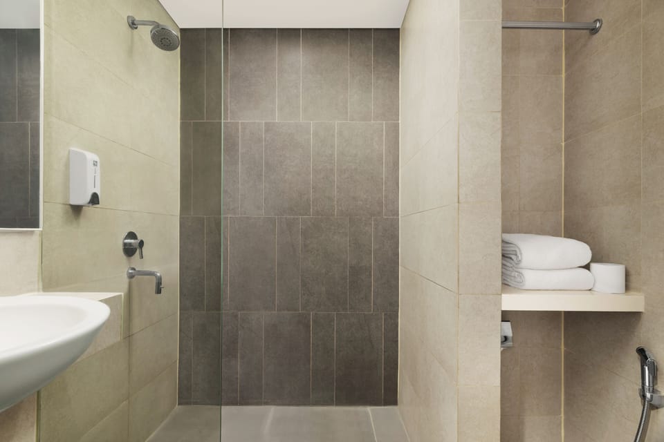 Shower, free toiletries, hair dryer, slippers