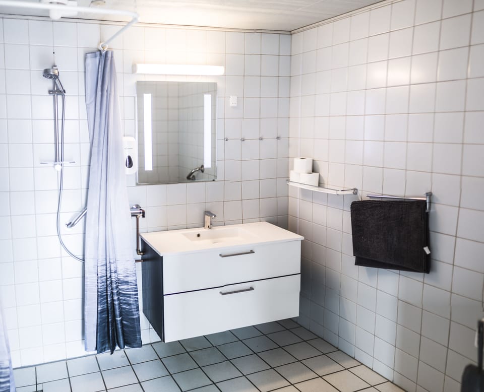 Family Studio, Accessible, Private Bathroom | Bathroom | Shower, towels, soap, toilet paper