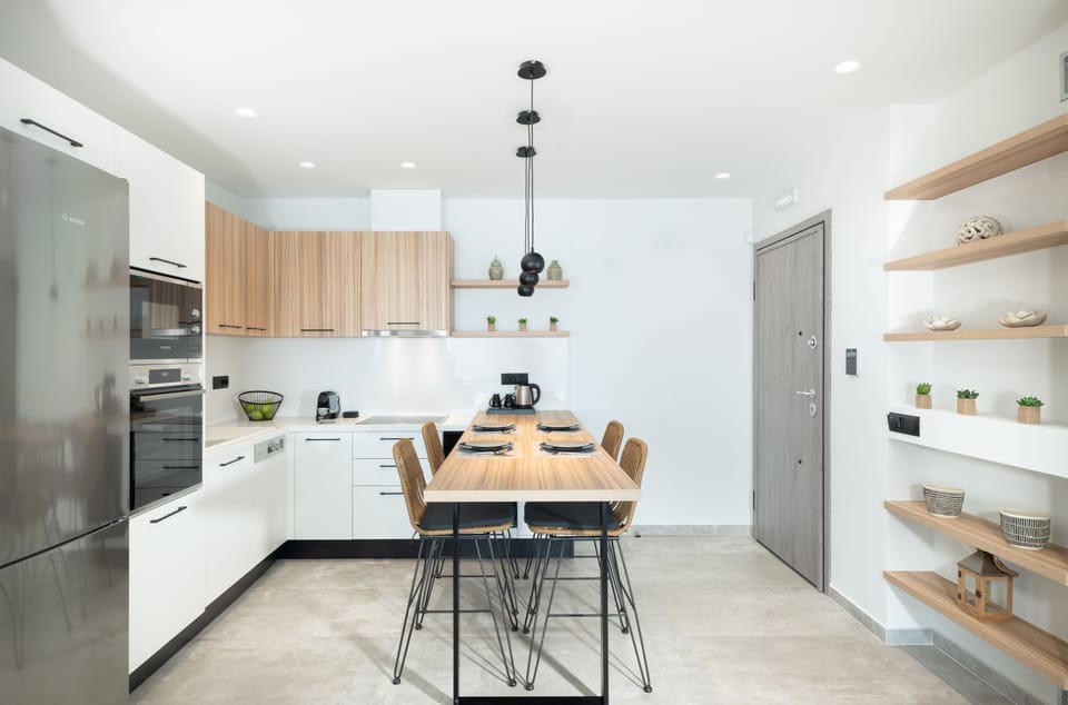 Fully equipped kitchen with indoor dining area.