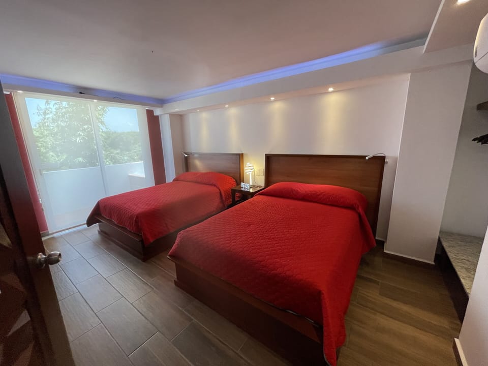 Deluxe Quadruple Room | Minibar, in-room safe, laptop workspace, free WiFi