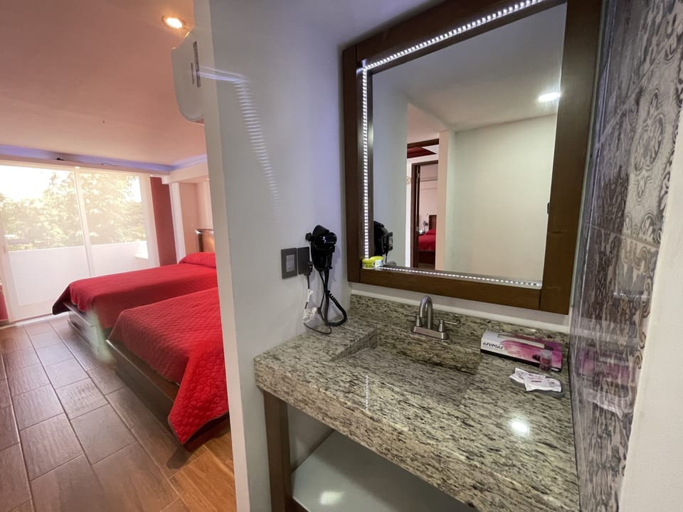 Deluxe Quadruple Room | Minibar, in-room safe, laptop workspace, free WiFi