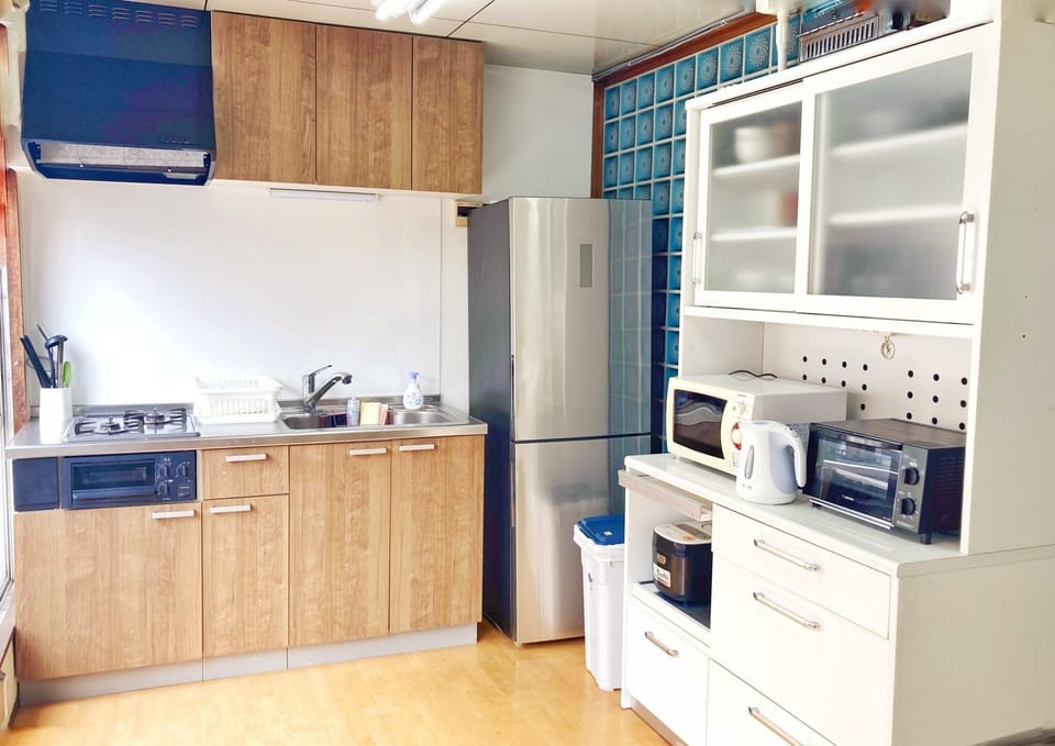 Spacious kitchen with kitchen appliances.