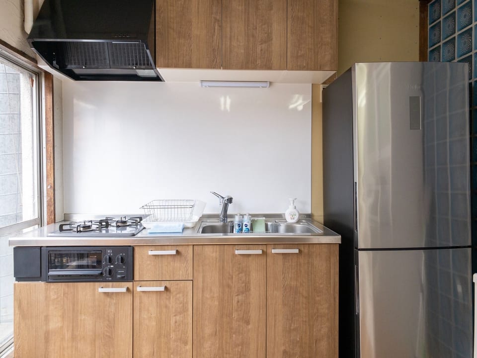 Spacious kitchen with kitchen appliances.
