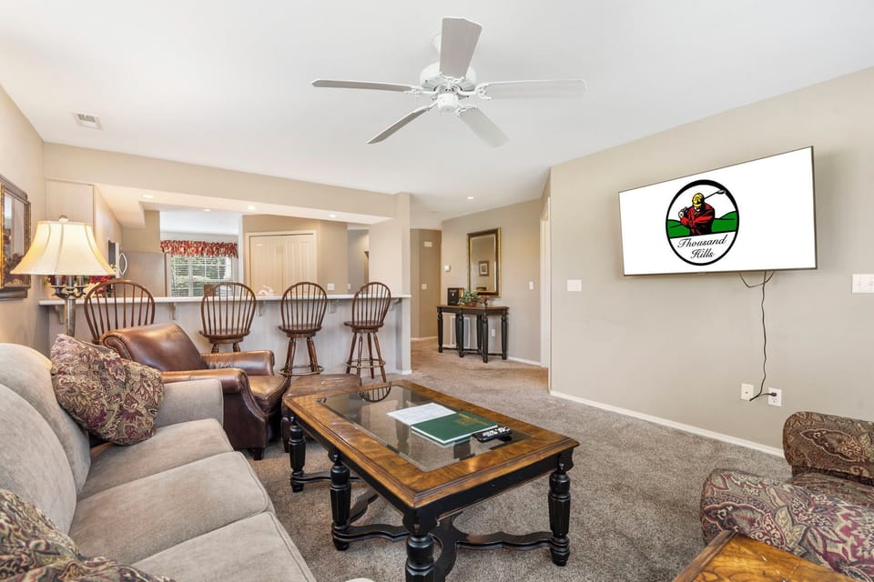 Living Area with Sunroom Access, Cable, Flatscreen TV, and Sofa Bed