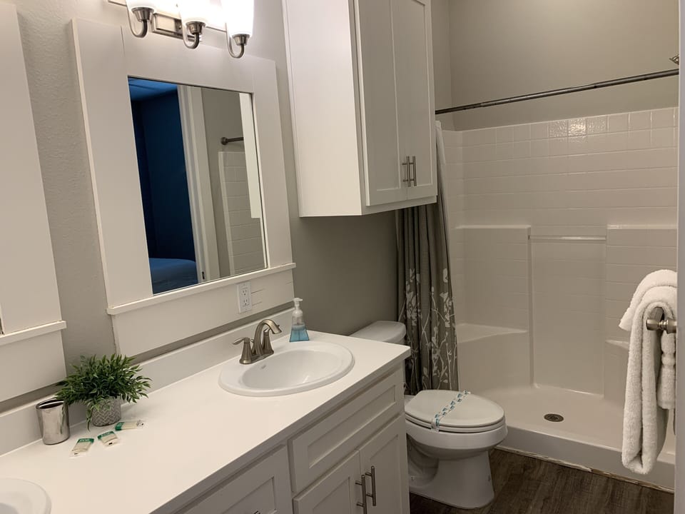 Bathroom #2 has a walking shower. 