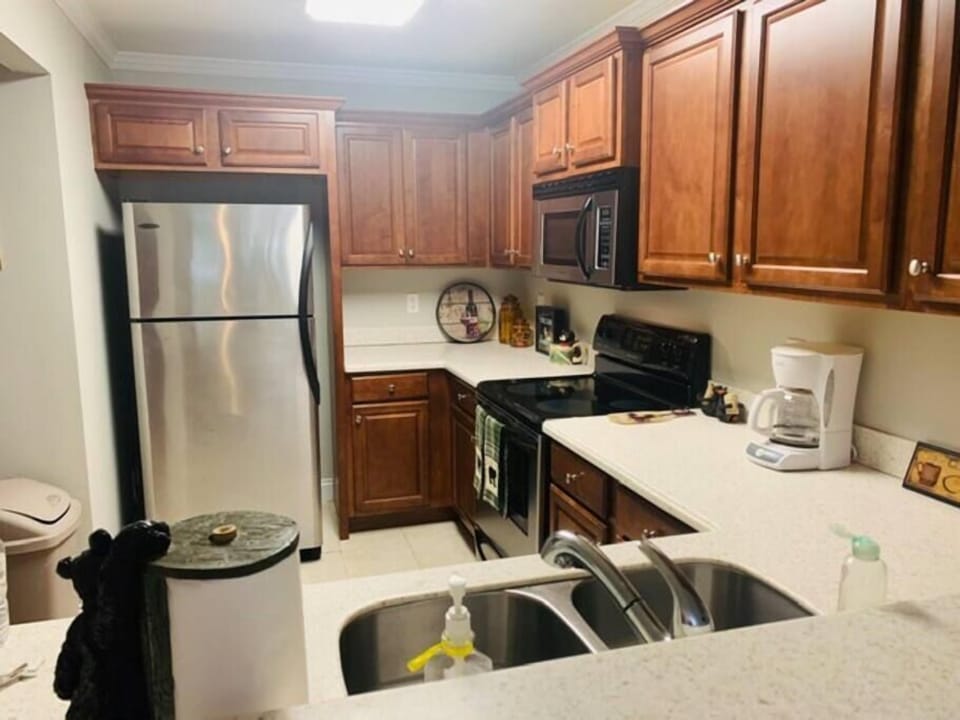 Lots of cabinets, stainless steel appliances plus a breakfast bar