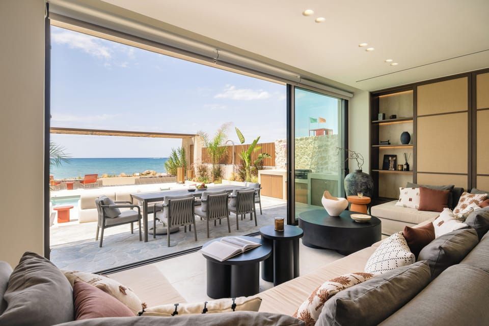 The outdoor kitchen sets the scene for relaxed meals by water.