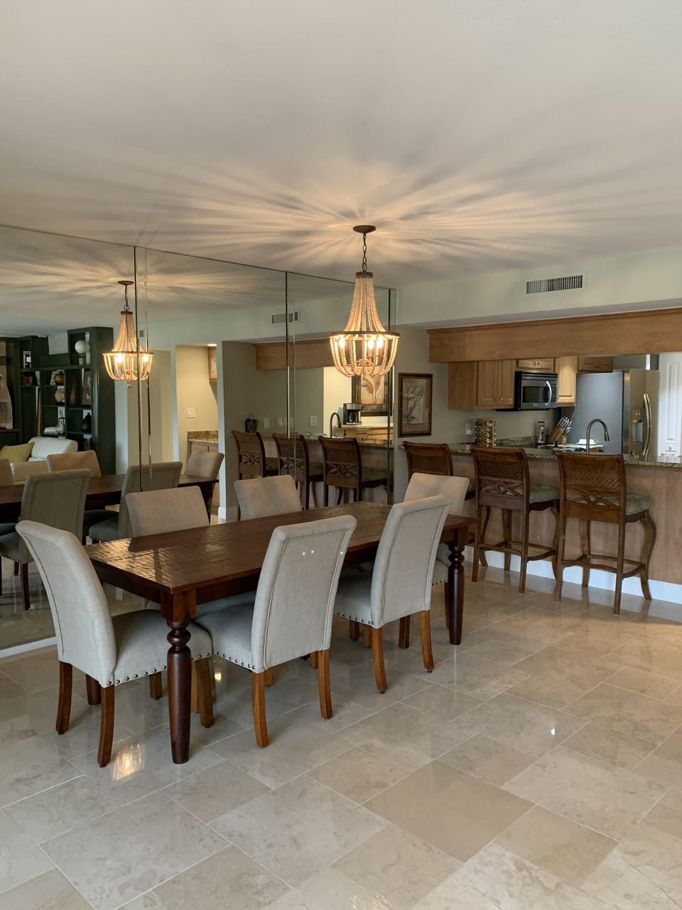 Dining room with comfortable seating for 6 along with barstools for 3
