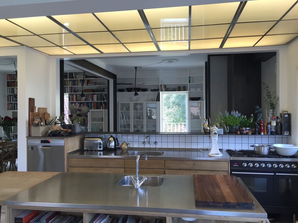 The kitchen and the bar facing the livingroom