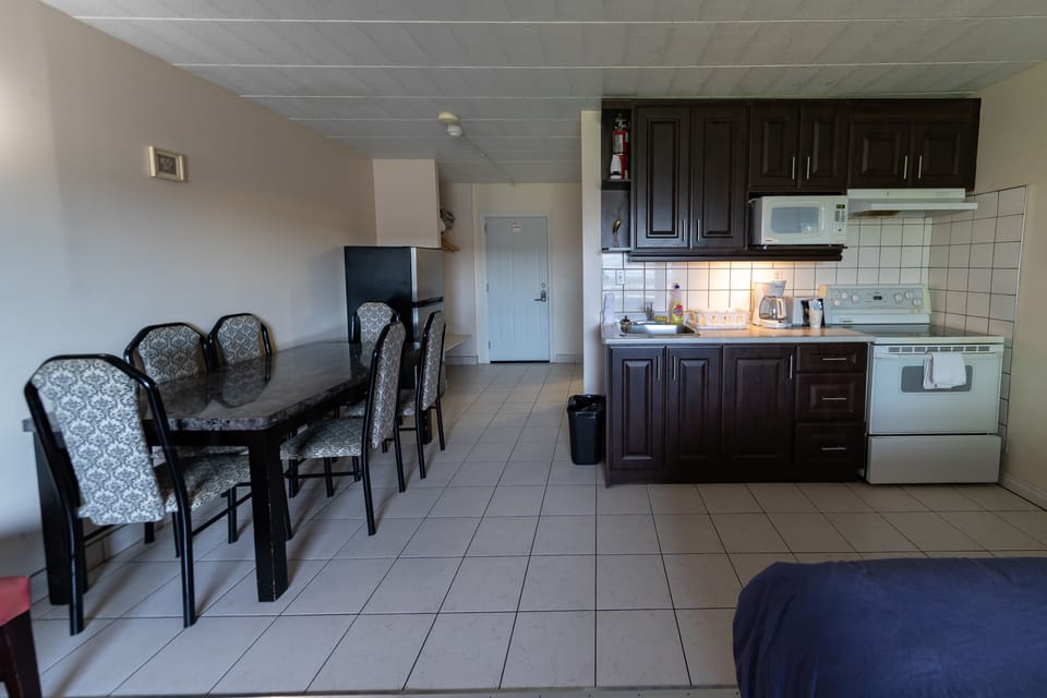 Family Room, Multiple Beds, Private Bathroom | Down comforters, desk, blackout drapes, iron/ironing board