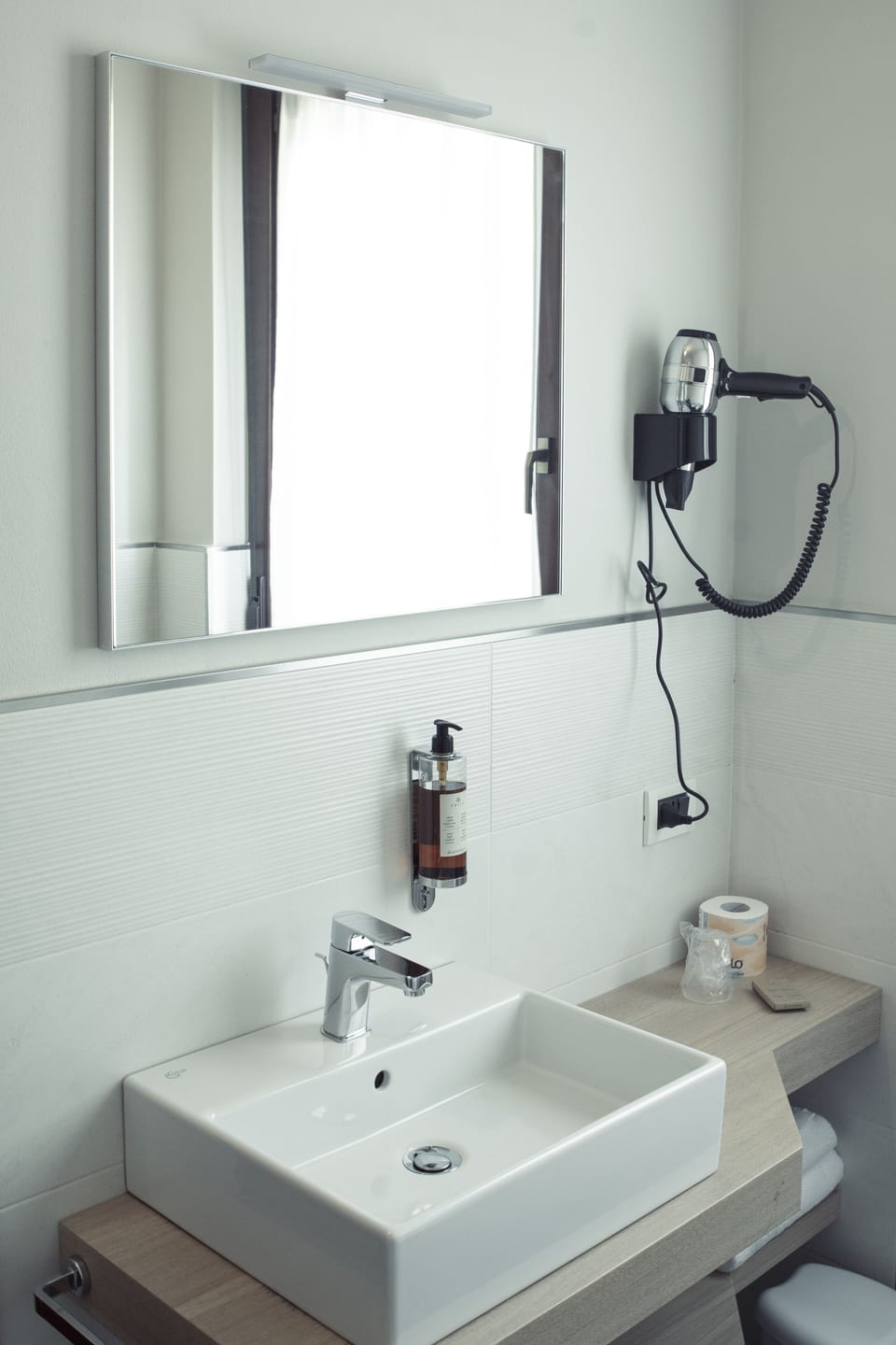 Bathtub, hair dryer, bathrobes, slippers