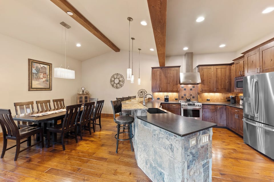 Your gourmet kitchen features gleaming granite countertops and a spacious island perfect for gathering with loved ones during meal prep.