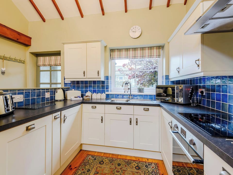 Kitchen | Ysgubor - Rhyddallt Ganol Cottages, Caethro, near Caernarfon