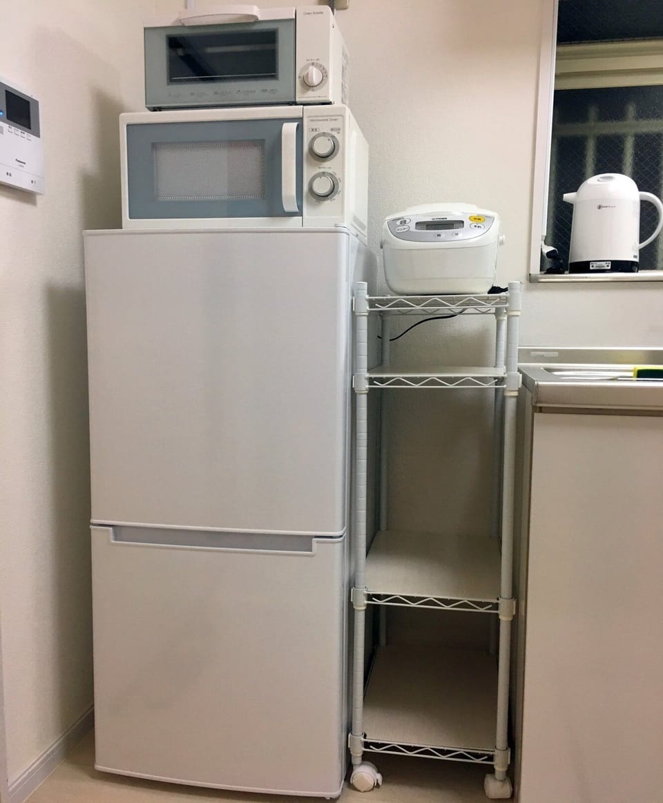 Kitchen, refrigerator and rice cooker