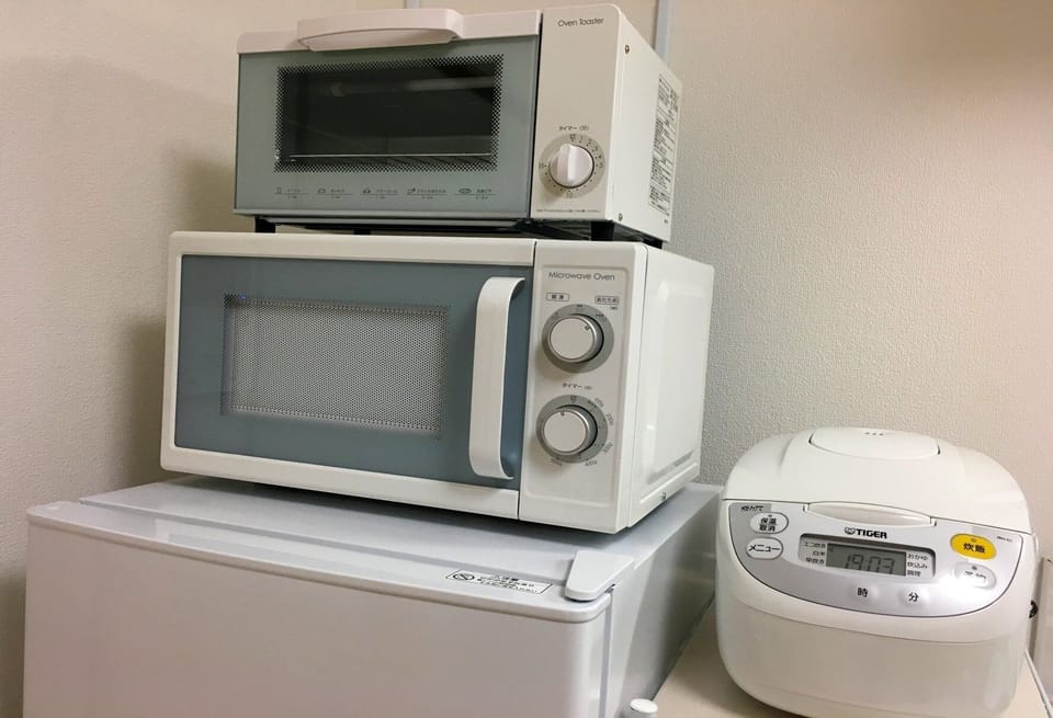 Kitchen/microwave oven and open toaster etc.