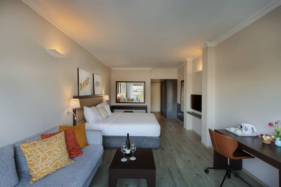 Superior With Balcony | Minibar, in-room safe, desk, laptop workspace