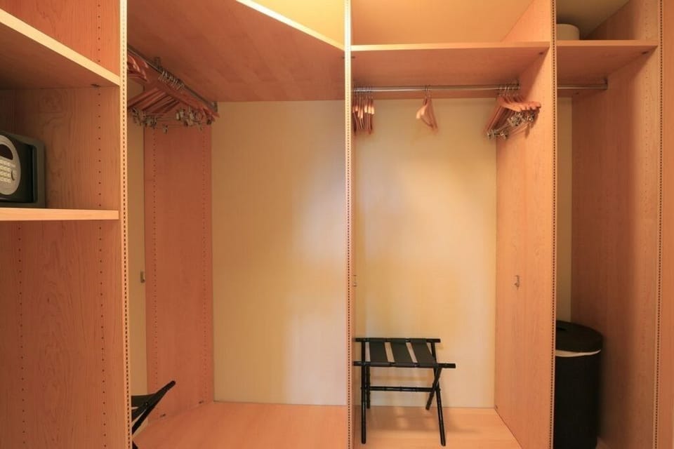 Master Bedroom walk-in closet.  There is a programable safe in this closet. 