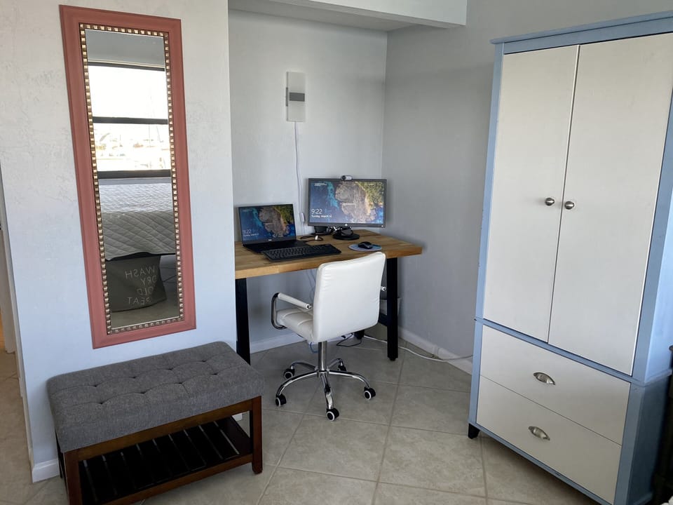 2'x4' workspace with monitor, keyboard, mouse, webcam and USB connected internet