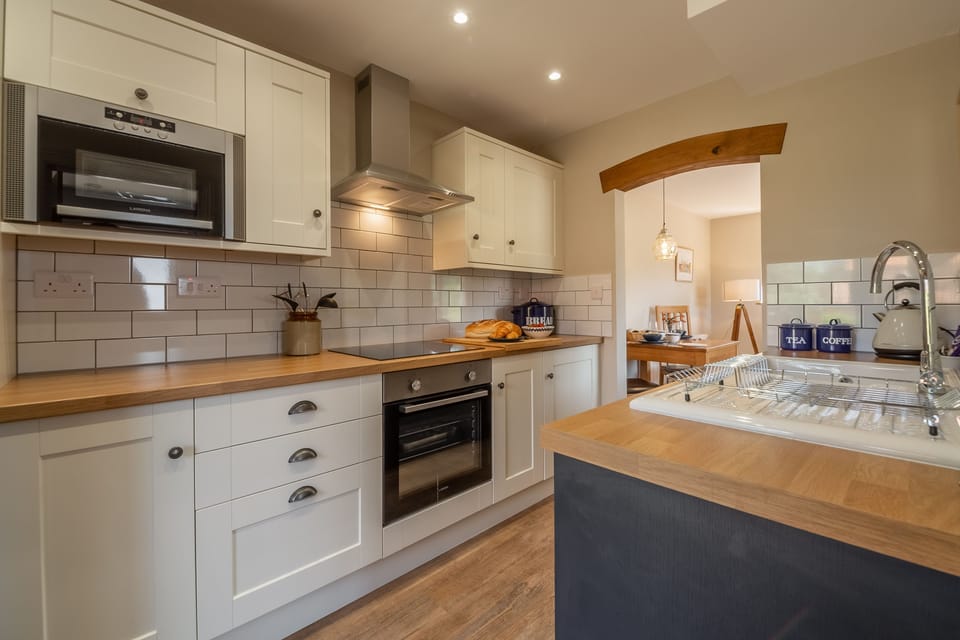 Ground floor: Kitchen looking into open-plan dining area and sitting room