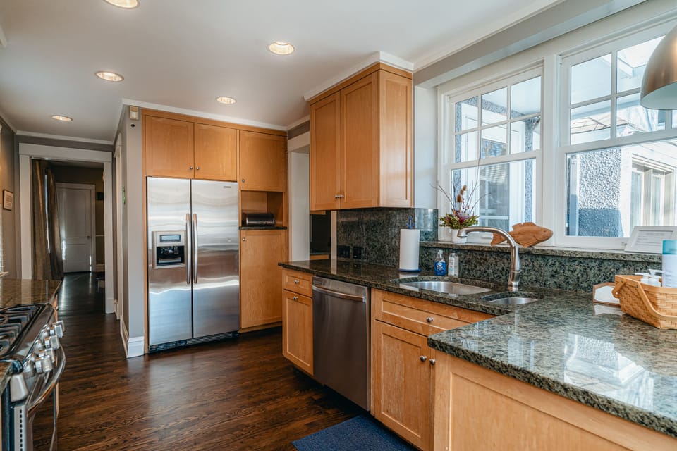 New chefs kitchen with stainless steel appliances and granite countertops