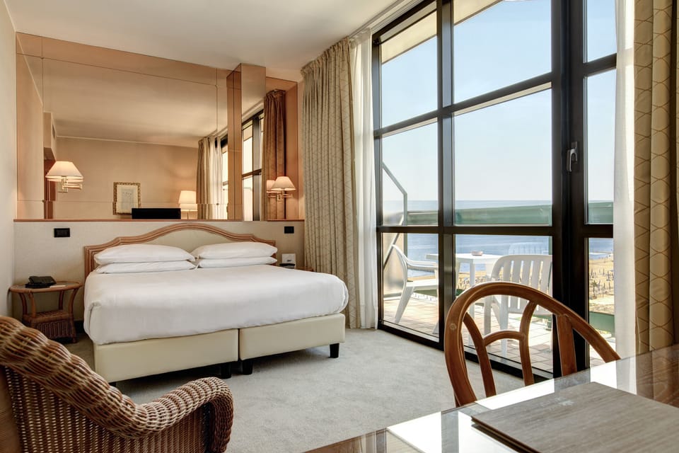 Deluxe Double Room, Partial Sea View | Minibar, in-room safe, desk, WiFi (free)