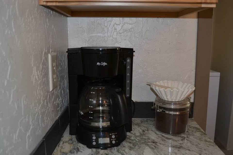 Mr. Coffee with good old Folgers. Many guests bring thier own 'brew' :)