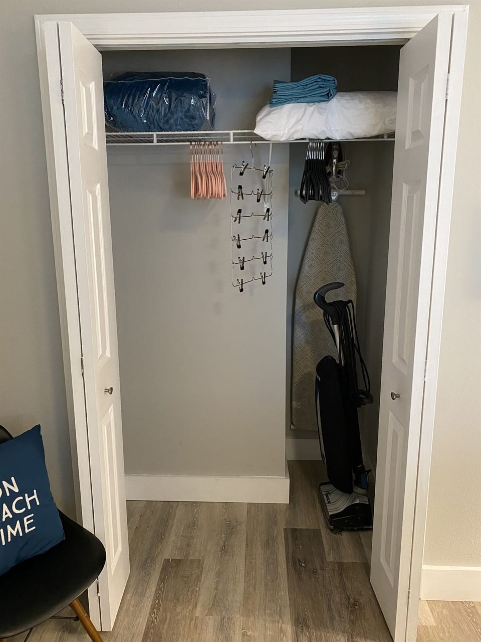 Master closet with plenty of storage and hangers.