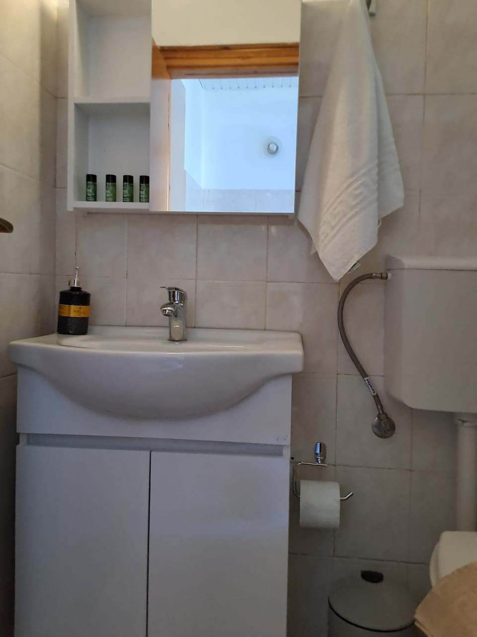 Shower, rainfall showerhead, hair dryer, towels