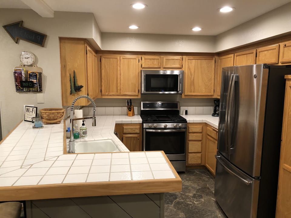 High-end appliances and gas burning stove. Ice maker and water in the fridge. 