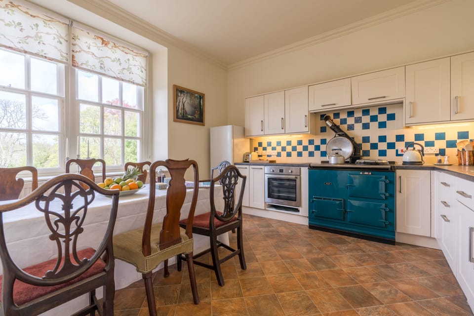 Ground floor: The kitchen with dining table and views across The Estate