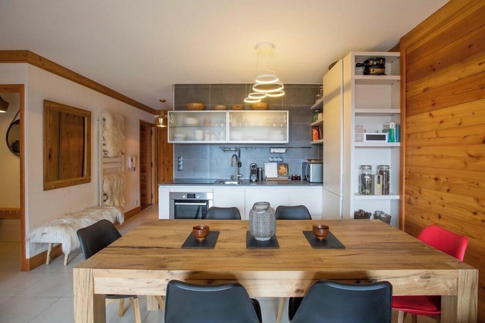 Dining Area with large table and seating area for up to 8 people overlooking the piste.