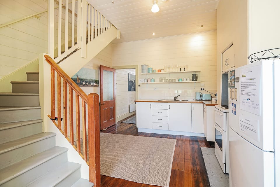 A staircase leads you upstairs to the home’s cosy, light-filled bedrooms.