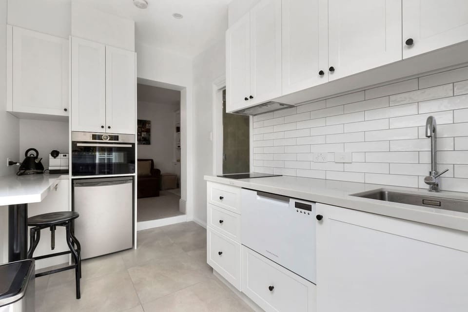 The charming kitchen offers the compact basics you will need to prepare a meal including an induction stove, oven and dishwasher.
