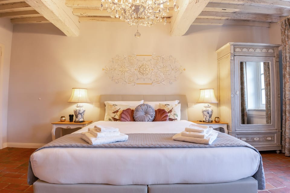 Signature Triple Room, Garden View (Gelsomino) | Minibar, in-room safe, individually decorated, individually furnished