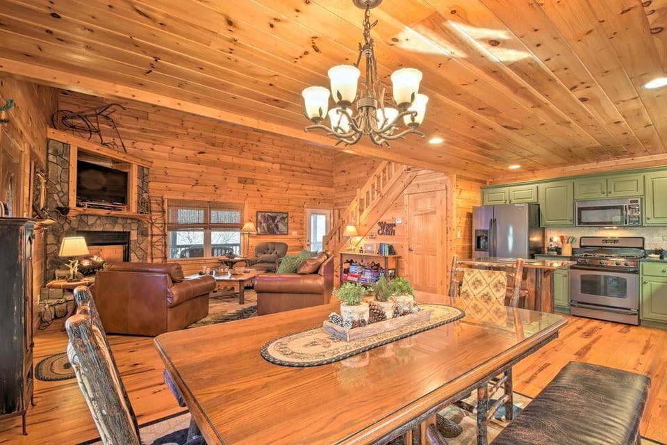 Open main level with dining, kitchen, and living area, perfect for gathering together