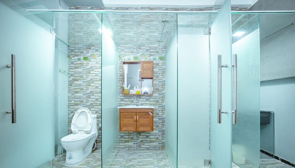 Apartment, 2 Queen Beds | Bathroom | Shower, hydromassage showerhead, free toiletries, hair dryer