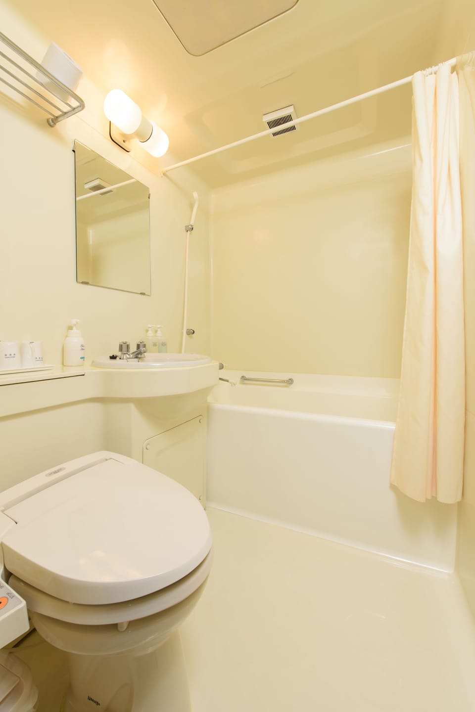 Combined shower/tub, free toiletries, hair dryer, slippers
