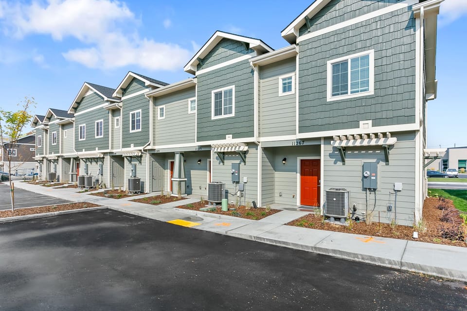 View of the back of the townhomes and parking