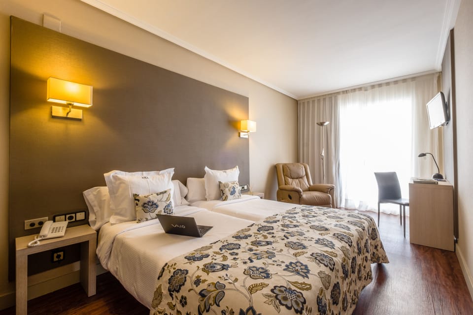 Premium bedding, down comforters, minibar, in-room safe