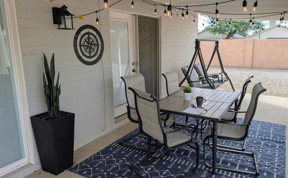 Relax on our updated patio with new furniture, décor, and warm string lights.