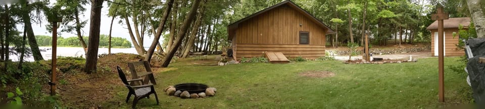 The campfire ring is next to the water. 