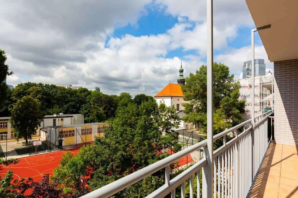 The balcony provides a perfect spot for enjoying the fresh air. 